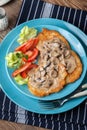 Crispy fried homemade potato pancakes with mushroom sauce Royalty Free Stock Photo