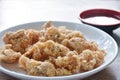 crispy fried Korean chicken with bread crumb and egg yolk on plate dipping barbecue sauce Royalty Free Stock Photo