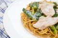Crispy fried noodle with pork and kale soaked in gravy Royalty Free Stock Photo