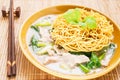 Crispy fried noodle with pork soaked in gravy Royalty Free Stock Photo