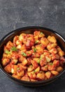 fried spanish potatoes with paprika sauce in bowl