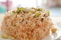 Crispy fried thin rice noodles with coconut cream topping peanut and slice lemon leaf on plate Royalty Free Stock Photo