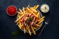 Crispy fries with tomato sauce and mayonnaise in foodgraphy