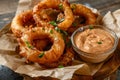 Crispy golden onion rings served with spicy dipping sauce Royalty Free Stock Photo