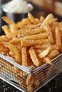 Crispy golden potato chips deep fried to perfection with seasonings in bubbling oil