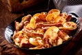 Crispy golden potato with spicy sausage and bacon Royalty Free Stock Photo