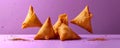 Crispy Golden Samosas on a Purple Background with Spices Traditional Indian Cuisine Appetizers