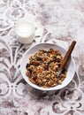Crispy granola muesli with dried fruits, nuts and seeds and a jar of yogurt Royalty Free Stock Photo