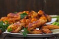 Crispy grilled chicken wings on a white plate Royalty Free Stock Photo