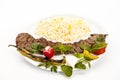 Crispy Grilled Lamb Kebab Dish On White Table Royalty Free Stock Photo