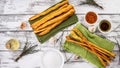 Crispy grissini breadsticks. Traditional Italian wheat bread with garlic, cheese and sesame seeds. Food still life