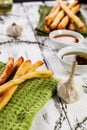 Crispy grissini breadsticks. Traditional Italian wheat bread with garlic, cheese and sesame seeds. Food still life