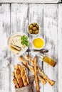 Crispy grissini breadsticks. Traditional Italian wheat bread with garlic, cheese and sesame seeds. Food still life