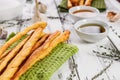 Crispy grissini breadsticks. Traditional Italian wheat bread with garlic, cheese and sesame seeds. Mediterranean food still life