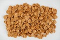 Crispy healthy dry cereal flakes on white background