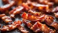 Crispy hot fried bacon pieces closeup