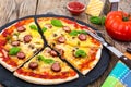 Crispy hot pizza on old wooden table Royalty Free Stock Photo