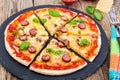 Crispy hot pizza on old wooden table Royalty Free Stock Photo