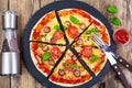 Crispy hot pizza on old wooden table Royalty Free Stock Photo