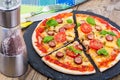 Crispy hot pizza on old wooden table Royalty Free Stock Photo