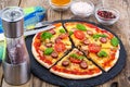 Crispy hot pizza on old wooden table Royalty Free Stock Photo