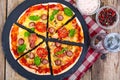 Crispy hot pizza on old wooden table Royalty Free Stock Photo