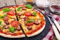 Crispy hot pizza on old wooden table Royalty Free Stock Photo
