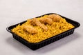 Crispy Kabsa Meal with chicken piece served in a dish isolated on grey background side view