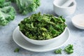 Crispy kale chips in bowl, healthy vegan food