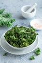 Crispy kale chips in bowl, healthy vegan food