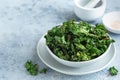 Crispy kale chips in bowl, healthy vegan food