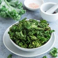 Crispy kale chips in bowl, healthy vegan food