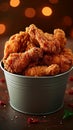 Crispy Kentucky fried chicken piled high in a bucket