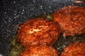 Crispy meatballs fry in oil in a pan macro shot eat theme