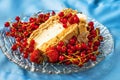 Crispy meringue cake with strawberry and currant.