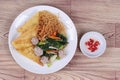 Crispy noodle topped kale soup with meatball Royalty Free Stock Photo