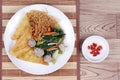 Crispy noodle topped kale soup with meatball . Top view. Royalty Free Stock Photo