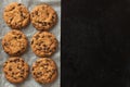 Crispy oatmeal cookies with chocolate on baking paper. Homemade cakes Royalty Free Stock Photo