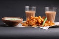 Crispy pakoras, Aloo pakoda, pyaaz pakoda, mirchi pakoda in rainy season with hot chai or tea