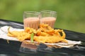 Crispy pakoras, Aloo pakoda, pyaaz pakoda, mirchi pakoda in rainy season with hot chai or tea
