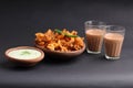 Crispy pakoras, Aloo pakoda, pyaaz pakoda, mirchi pakoda in rainy season with hot chai or tea