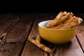 Crispy Pastry Sticks on wooden background