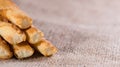 Crispy Pastry Sticks on wooden background