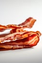 Crispy pieces of bacon on a white background, Generative AI