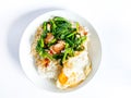 Crispy pork with Chinese broccoli on rice and fried egg Royalty Free Stock Photo