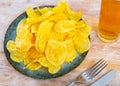 Potato chips served with glass of beer Royalty Free Stock Photo