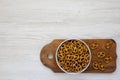 Crispy Pretzel Crackers in a Gray Bowl on a white wooden table, top view. Flat lay, overhead, from above. Copy space Royalty Free Stock Photo