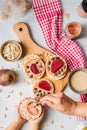 Crispy puffed rice cakes on table hummus spread and tomato and beet vegetables and sesame pumpkin seeds on the table - top view on Royalty Free Stock Photo