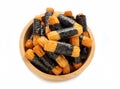 Crispy rice cakes wrapped in seaweed in a wooden bowl. Nori maki rice crackers. Royalty Free Stock Photo