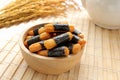 Crispy rice cakes wrapped in seaweed in a wooden bowl. Nori maki rice crackers. Royalty Free Stock Photo